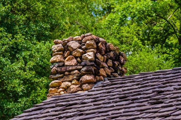 how to install a wood stove chimney through the roof